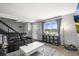 Inviting living room with comfortable black leather seating and natural light at 6838 S Broadway, Centennial, CO 80122