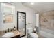 Well-lit bathroom offers a shower/tub combo with neutral tile, modern fixtures and granite vanity at 3629 Kalamath St, Denver, CO 80211