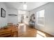 Bright dining area features hardwood floors, a table for four, and natural light at 3629 Kalamath St, Denver, CO 80211
