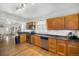 Charming kitchen with wood cabinets, stainless appliances and adjacent to the dining area at 3629 Kalamath St, Denver, CO 80211