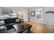 Inviting living room with a comfortable couch, large windows, and hardwood flooring at 3629 Kalamath St, Denver, CO 80211