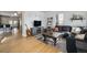 Cozy living room features hardwood floors, a comfortable sectional and lots of light at 3629 Kalamath St, Denver, CO 80211