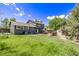 Spacious backyard featuring a well-maintained lawn, patio area, shed, and mature trees at 6062 S Newport St, Centennial, CO 80111