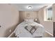 Neutral bedroom with a full bed, minimalist decor, and a window bringing in natural light at 6062 S Newport St, Centennial, CO 80111