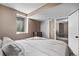 Cozy bedroom featuring a window and connecting door to another room at 6062 S Newport St, Centennial, CO 80111