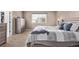 Cozy bedroom features a double bed, a window with blinds, and a dresser at 6062 S Newport St, Centennial, CO 80111