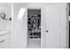 Bright white walk-in closet with shelving and hanging space at 6062 S Newport St, Centennial, CO 80111
