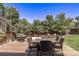 Wood deck features a table and six chairs, a grill, and mature landscaping at 6062 S Newport St, Centennial, CO 80111