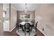 Charming dining area featuring modern lighting and a round wooden table at 6062 S Newport St, Centennial, CO 80111