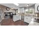 Bright kitchen with granite countertops, wooden floors, and a skylight at 6062 S Newport St, Centennial, CO 80111