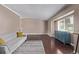 Bright living room featuring hardwood floors, a large window, and a comfortable couch with decorative pillows at 6062 S Newport St, Centennial, CO 80111