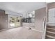 Spacious living room with access to a backyard deck and adjacent kitchen at 6062 S Newport St, Centennial, CO 80111