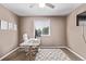 Home office with white desk, computer, and ceiling fan at 6062 S Newport St, Centennial, CO 80111