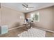 The bedroom has been staged as an office space, which includes a desk and storage at 6062 S Newport St, Centennial, CO 80111