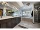 A well-lit bathroom features a double vanity, soaking tub, and a separate tiled shower at 5371 Hazel Rd, Evergreen, CO 80439