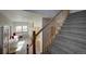 Entryway with bench seating and a carpeted stairway at 5371 Hazel Rd, Evergreen, CO 80439