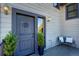 Inviting front entrance with a stylish door, elegant sidelight, and cozy bench seating at 5371 Hazel Rd, Evergreen, CO 80439