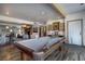A large game room featuring a pool table, seating, and built-in shelves at 5371 Hazel Rd, Evergreen, CO 80439