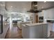 Spacious kitchen with modern appliances, white cabinetry, and a large island at 5371 Hazel Rd, Evergreen, CO 80439
