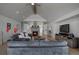 Bright living room boasts stone fireplace, vaulted ceiling, and hardwood floors at 5371 Hazel Rd, Evergreen, CO 80439