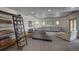 Bright living room features recessed lighting, contemporary furniture, and unique shelving unit at 5371 Hazel Rd, Evergreen, CO 80439