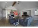 Bright living room boasts stone fireplace, vaulted ceiling, and hardwood floors at 5371 Hazel Rd, Evergreen, CO 80439
