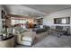 Spacious living room featuring an open floor plan and neutral tones at 5371 Hazel Rd, Evergreen, CO 80439