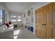 Well-organized mudroom with custom built-in shelving, ample storage, and natural light at 5371 Hazel Rd, Evergreen, CO 80439