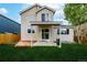 Backyard features a well-maintained lawn, a covered patio, and a cozy wooden deck at 5238 S Jericho Way, Centennial, CO 80015