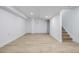 This bright finished basement features plank flooring, recessed lighting and a staircase at 5238 S Jericho Way, Centennial, CO 80015