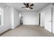 Bright bedroom with carpeted floor, ceiling fan, and multiple doors at 5238 S Jericho Way, Centennial, CO 80015