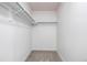 This carpeted closet offers plenty of storage with a hanging rod for easy organization at 5238 S Jericho Way, Centennial, CO 80015