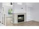 Elegant fireplace with a decorative tile surround and built-in shelving adds charm to the living space at 5238 S Jericho Way, Centennial, CO 80015