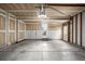 Spacious two car garage featuring concrete floors and unfinished drywall, ready for customization at 5238 S Jericho Way, Centennial, CO 80015