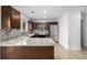 Bright kitchen features stainless steel appliances, stylish backsplash, and an island at 5238 S Jericho Way, Centennial, CO 80015