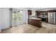 Open kitchen features stainless steel appliances, stylish backsplash, and an island at 5238 S Jericho Way, Centennial, CO 80015
