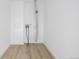 This laundry room features bright white walls and a floor drain, ready for customization at 5238 S Jericho Way, Centennial, CO 80015