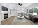 Inviting living room with a fireplace, comfortable seating, and a large window offers a cozy and stylish space at 5238 S Jericho Way, Centennial, CO 80015