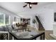 Open-concept living area with a staircase, dining space, and kitchen, perfect for modern living and entertaining at 5238 S Jericho Way, Centennial, CO 80015