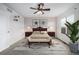 Cozy main bedroom with carpeted floor, ceiling fan, and decor at 5238 S Jericho Way, Centennial, CO 80015