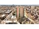 Excellent aerial view of high-rise building in city, displaying the building's unique architecture at 550 E 12Th Ave # 1203, Denver, CO 80203