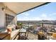 Relaxing outdoor balcony with comfortable seating and city views at 550 E 12Th Ave # 1203, Denver, CO 80203