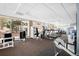 Bright gym with cardio machines, weightlifting equipment and expansive windows at 550 E 12Th Ave # 1203, Denver, CO 80203