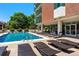 Relaxing pool area with comfortable lounge chairs for sunbathing and enjoying the summer at 550 E 12Th Ave # 1203, Denver, CO 80203