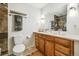 Bathroom featuring a double vanity, decorative towels, and a stylish mirror at 9325 Meade St, Westminster, CO 80031