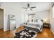 Bedroom with hardwood floors, a ceiling fan, and ample natural light from the large window at 9325 Meade St, Westminster, CO 80031