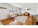 Cozy living room with hardwood floors, large window, and ample natural light at 9325 Meade St, Westminster, CO 80031