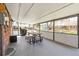 Inviting covered patio area with dining table and view of backyard at 9325 Meade St, Westminster, CO 80031