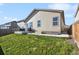 Backyard with a concrete patio and green lawn space at 98 Chipeta Way, Lochbuie, CO 80603