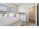 Bright bedroom with two windows and a white dresser at 98 Chipeta Way, Lochbuie, CO 80603